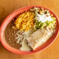 Regular Chimichanga · Fried flour tortilla filled with chicken or beef, served with rice, beans and cheese dip.