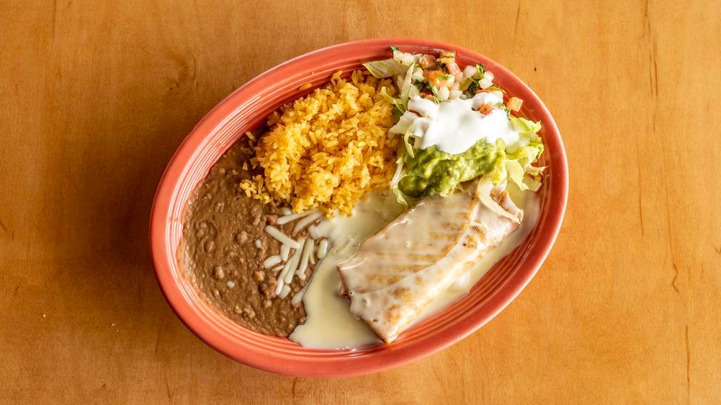 Special # 3 Lunch Chimichanga · Shredded chicken or ground beef in a flour tortilla covered with cheese dip served with rice, beans and salad.