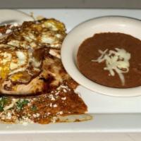 Chilaquiles · Deep fried corn tortillas cover with red or green sauce served with cilantro, onions, cheese...