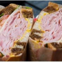 Ham & Swiss · Fresh cut ham, swiss cheese, lettuce, tomato, mayo and yellow mustard on marble rye.