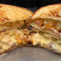 Chicken Salad Melt · Our homemade chicken salad, bacon and cheddar cheese, served hot on a panini.