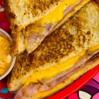 Grilled Ham And Cheese · Grilled, sliced ham and melted cheese on toasted deli white.