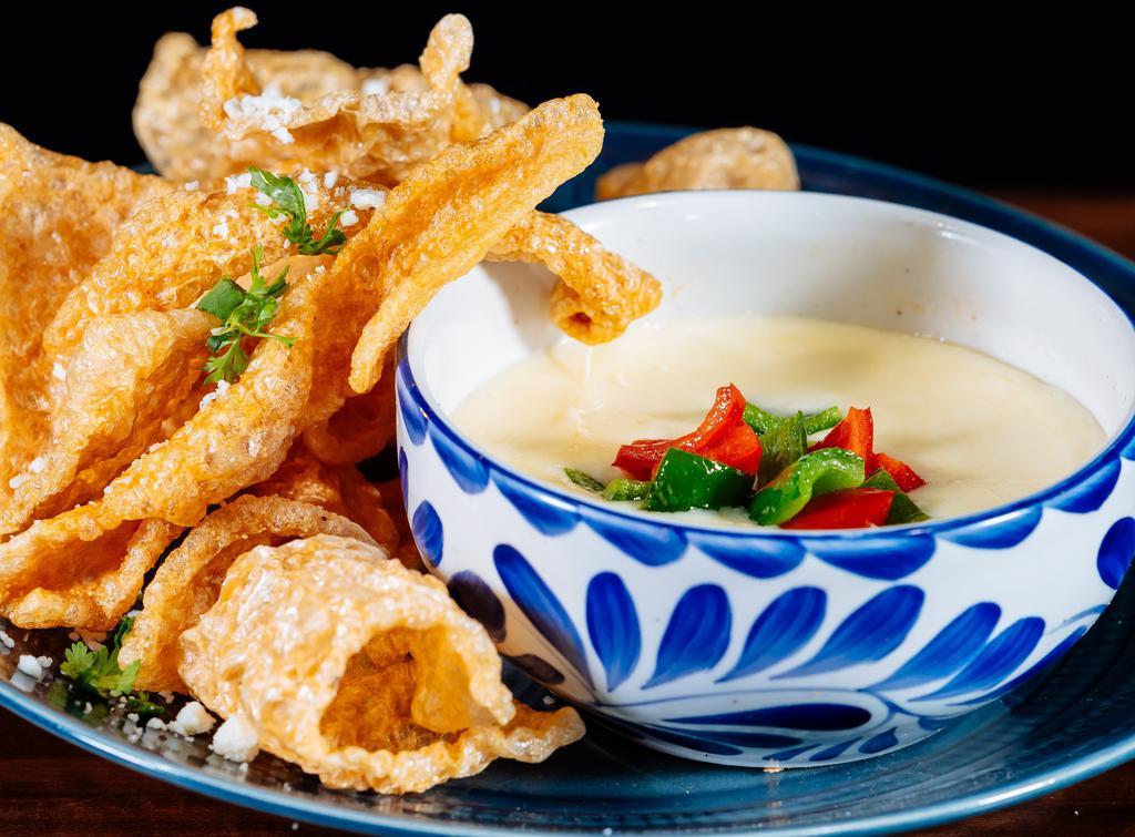 Chips Con Queso · White cheese dip served with tortilla chips.