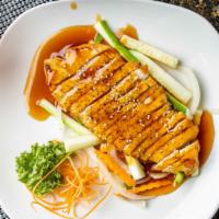 Chicken Teriyaki · Grilled chicken topped with teriyaki sauce and sesame seeds served on a bed of steamed veget...