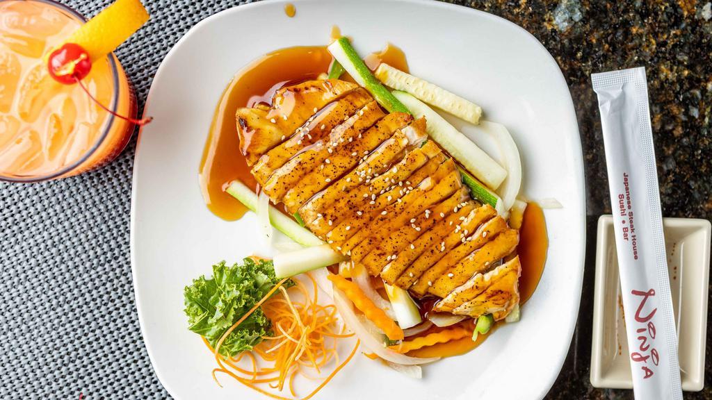 Chicken Teriyaki · Grilled chicken topped with teriyaki sauce and sesame seeds served on a bed of steamed vegetables.