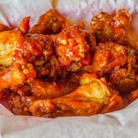 8Ct Flavored Wings · Naked wings tossed in the sauce of your choice