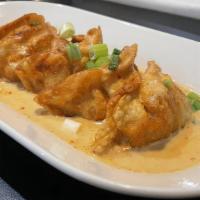 Curry Potstickers (5) · Pan seared chicken and vegetable dumplings, topped with a red curry basil glaze.