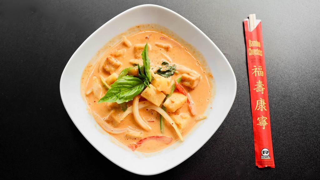 Gang Deang (Red Curry) · A spicy and delicious curry with bamboo shoots, red and green bell peppers, onions, and fresh Thai basil leaves.