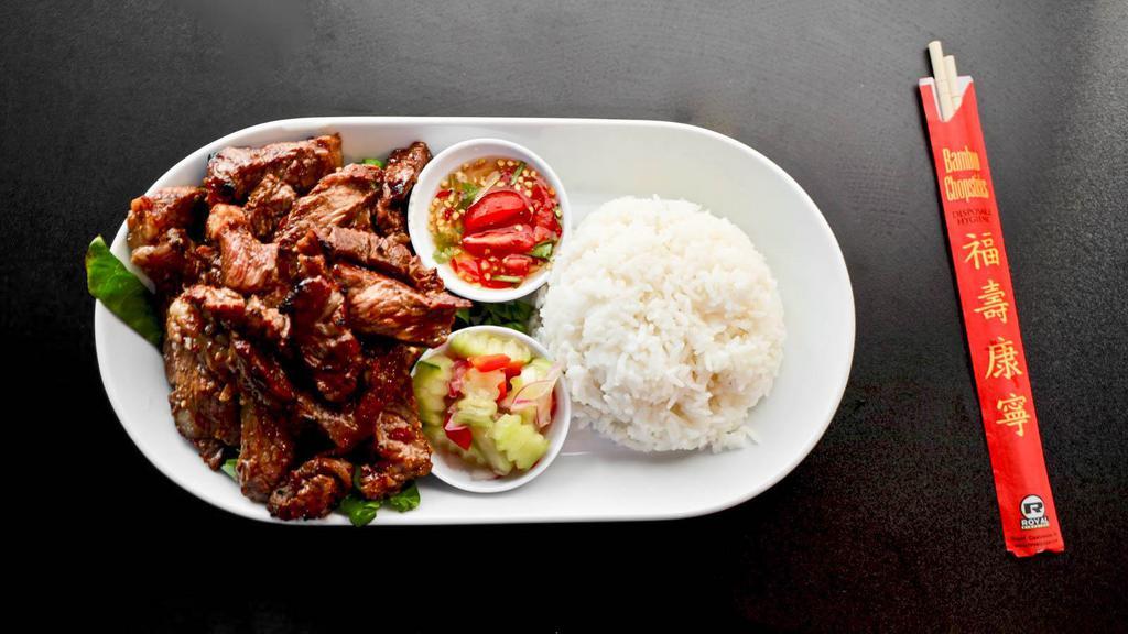 Muai Thai Beef · Marinated USDA choice ribeye, grilled. Served over lettuce with a side of cucumber salad. Served with jasmine rice.