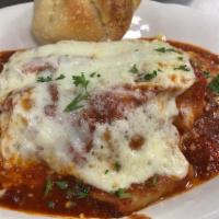 Ultimate Lasagna · Layers of lasagna noodles with beef, shaved meatballs and 4 cheeses in our slow simmered sauce