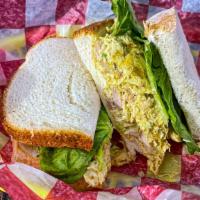 Tuna Salad Sandwich · In house tuna salad with red onions, celery and a hint of lemon. Served on a croissant or Ar...