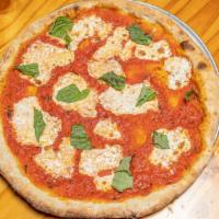 Margherita Pizza · San marzano tomato sauce, basil Fresh mozzarella and extra Virgin Olive Oil.