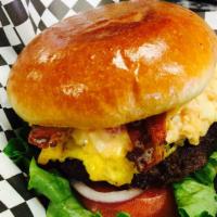 Jake Burger · 1/3 lb. burger topped with pimento cheese and bacon, served with crinkle cut fries.