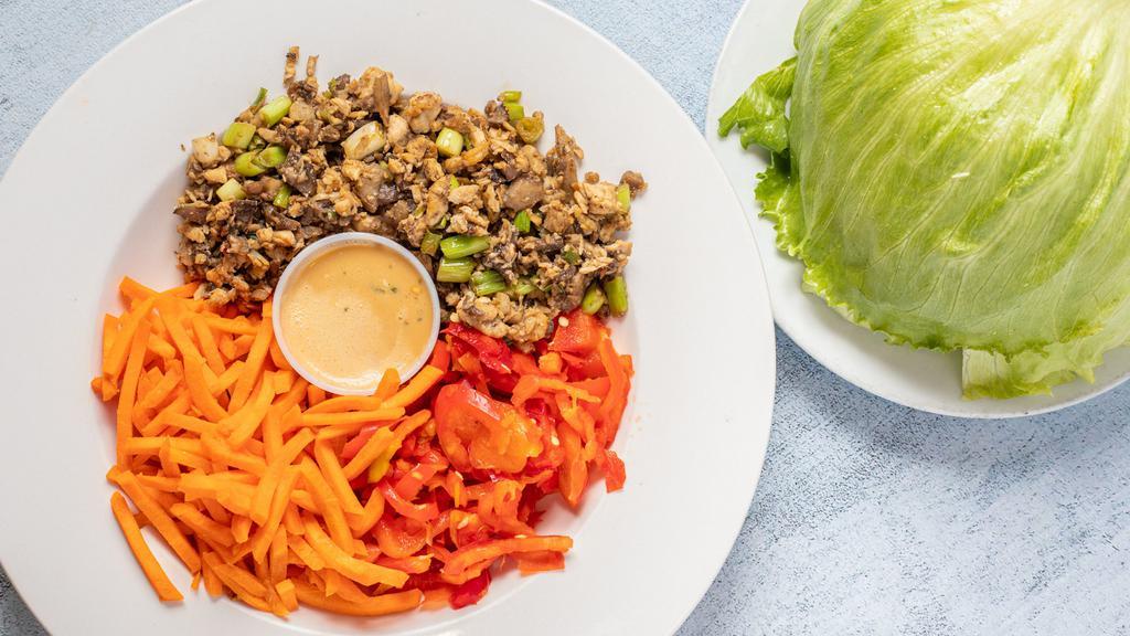 Thai Lettuce Wraps · Tender chicken, fresh cut jicama, button mushrooms and scallions wok-seared in our signature sauce.  Carrots, red bell peppers and Thai peanut sauce served on the side.