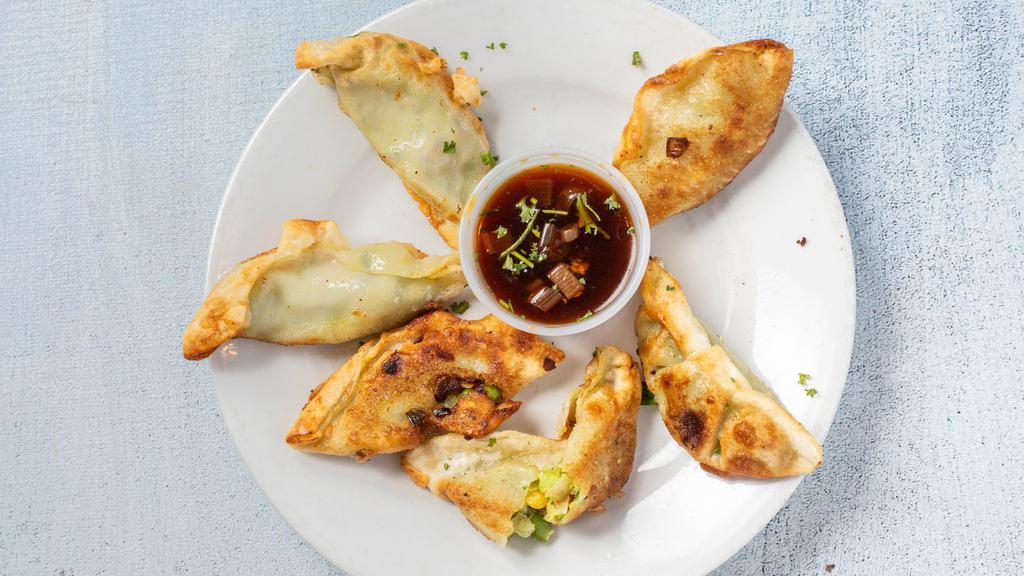 6 Edamame Potstickers · Six tender dumplings filled with a blend of hearty edamame soybean pieces and lightly seasoned vegetables served with a zesty soy lime dipping sauce.