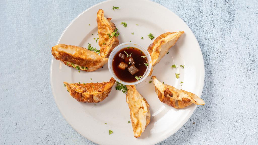 6 Potstickers · Six plump chicken and cabbage-stuffed dumplings, made complete with a zesty soy lime dipping sauce.