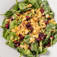 Full Cranberry Spinach Salad · Fresh spinach, dried cranberries and spiced almonds tossed with a sweet poppy seed dressing....