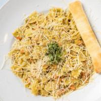 Basil Pesto · Farfalle pasta tossed with fresh mushrooms, tomatoes and and our original basil pesto cream ...