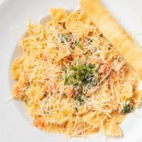 Pomodoro · Farfalle pasta and ripe Roma tomatoes meet a delightfully creamy wine-garlic sauce accompani...