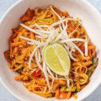 Thai Peanut · Rice noodles in a spicy peanut sauce with carrots, red peppers and scallions. Garnished with...