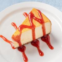 New York Cheesecake · A house favorite topped with your choice of strawberry puree, chocolate syrup or amaretto sy...