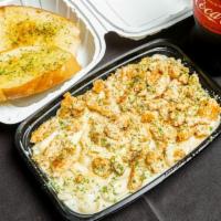 Chicken Fettuccine Alfredo · Flat thick pasta with rich butter and parmesan sauce and chicken.