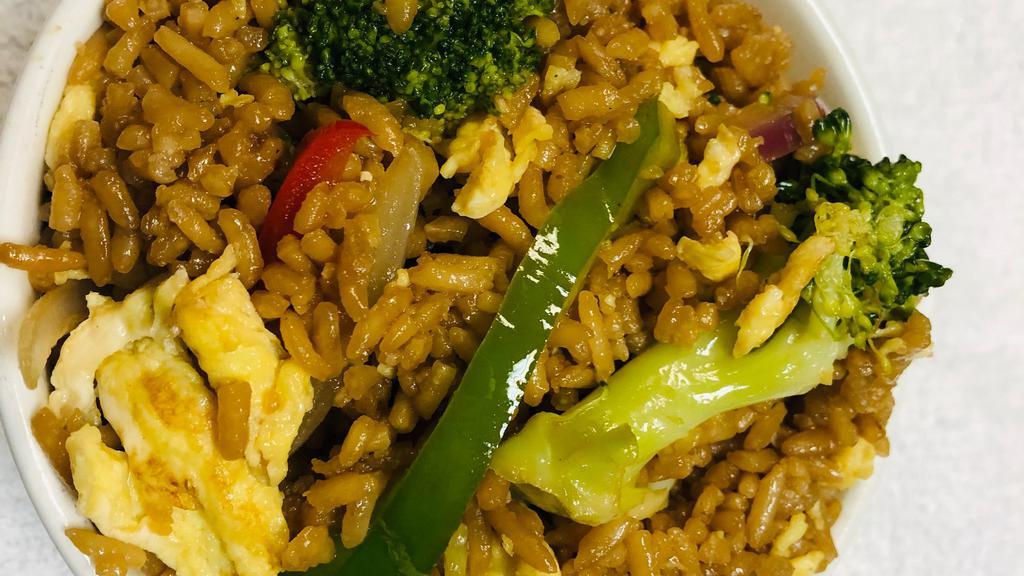 Vegetable Fried Rice  · Fresh vegetables lightly steamed and stir fried with rice and eggs in soy based sauce.