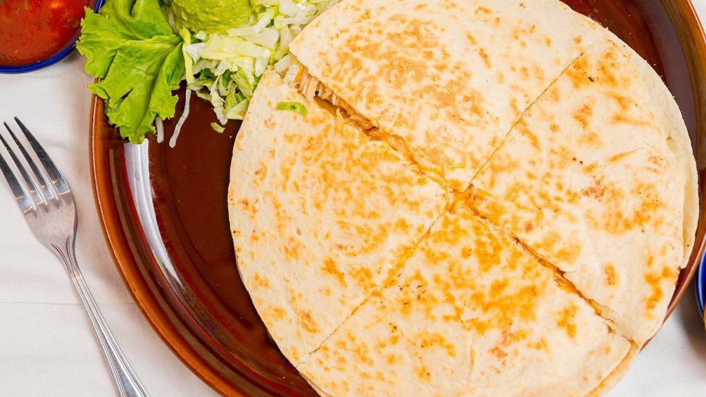 Fajitas Quesadillas · Crispy flour tortillas filled with cheddar and Monterrey jack cheeses, pico de gallo and torero’s delicious fajita steak or chicken. Served with sour cream, guacamole and choice of refried or rancho (cholesterol-free) beans, and Mexican rice.