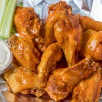 Wings · Made to order 12-15 minutes cook time. Served with ranch or Blue cheese and celery.