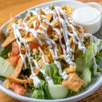 Rotisserie Salad · Romaine lettuce, cheese, tomatoes, cucumbers, black olives, sour cream, pickled jalapenos, c...