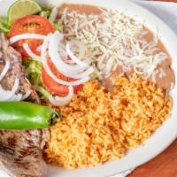 Grilled Steak · Seasoned steak, grilled onions and jalapeño with rice beans and salad