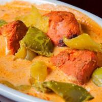 Chicken Tikka Masala · Tender chicken marinated and cooked in a tandoor and finished with a cream sauce
