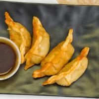 Gyoza · Six pieces.Your choice of fried or steamed