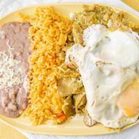 Chilaquiles With Meat · Fried handmade tortillas covered in red or green salsa topped with cheese and your choice of...