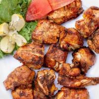 Grilled Chicken Tikka Kebob · Perfect oven-roasted chicken marinated in yogurt, lime juice, and aromatic spices.