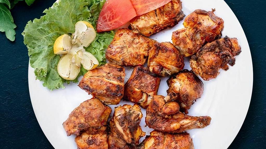 Grilled Chicken Tikka Kebob · Perfect oven-roasted chicken marinated in yogurt, lime juice, and aromatic spices.