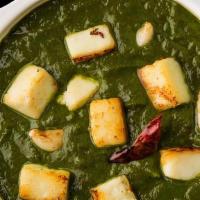 Palak Paneer Curry · Authentic cottage cheese simmered in smooth and cream spinach gravy.