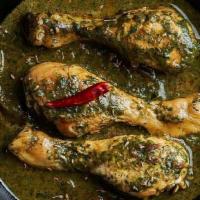 Saag Chicken Curry · Delicious chicken covered in spinach, mustard leaves, turnip greens, and spices.
