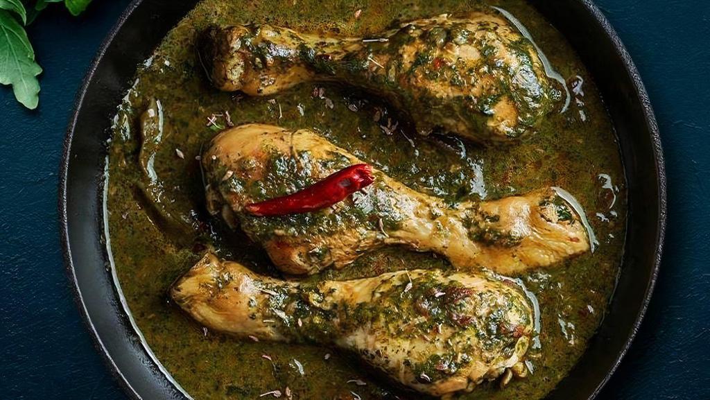 Saag Chicken Curry · Delicious chicken covered in spinach, mustard leaves, turnip greens, and spices.