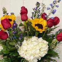 Sunflower Mix Bqt  · A fresh cut flower bqt that includeds red roses, white hydengrea, sunflowers, and blue delfi...