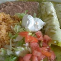Enchiladas Suizas · Two corn tortillas rolled and stuffed with chicken and cheese, topped with melted Monterrey ...
