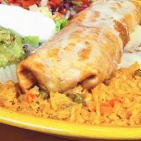 Santa Fe Chimichanga · Your choice of chicken or ground beef topped with a poblano queso dip, served with guacamole...
