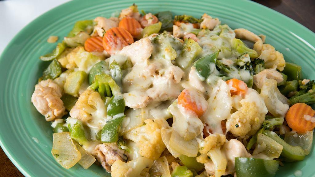 Mexican Stir Fry · Strips of chicken breast sautéed with mushrooms, onions, carrots, broccoli, and green peppers, then covered with Monterrey jack cheese and served on a bed of rice. Not served with beans.