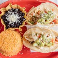 Street Tacos · Two large corn tortillas filled with grilled chicken, melted Monterrey jack cheese, honey-gr...