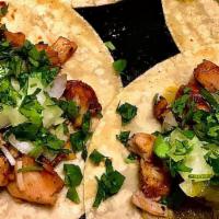 Pollo Asado Tacos · 3 tacos on marinated grilled chicken topped with onions and cilantro