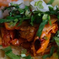 Tacos Al Pastor · 3 tacos Roasted pork, marinated with guajillo chiles ,pineapple and achiote, topped with cil...