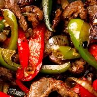 Steak Fajitas · Our famous authentic fajitas our sizzling fajitas are prepared with red peppers green pepper...