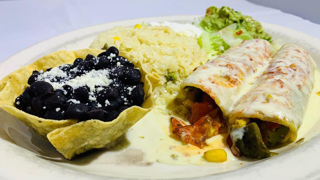 Delhi Enchiladas · A mixture of roasted poblano, red green and yellow bell peppers, sautéed with corn and onions, topped with a creamy red sauce with a hint of spice.