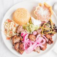 Pork Carnitas · Braised pork topped with a delightful mild tomato salsa and pickled onions. Served with rice...