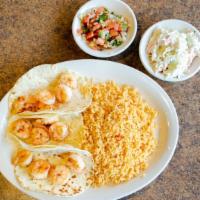 Shrimp Tacos · Three flour or corn tortillas with shrimp garnished with creamy coleslaw. Served with rice a...
